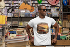 Man wearing a white t-shirt with a graphic red van design in a music store