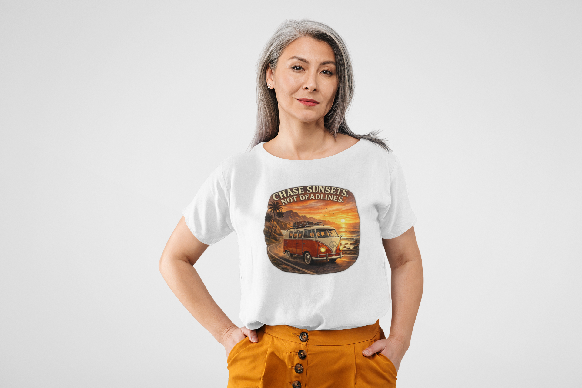 Woman wearing a white t-shirt with a classic red van graphic design on a plain background
