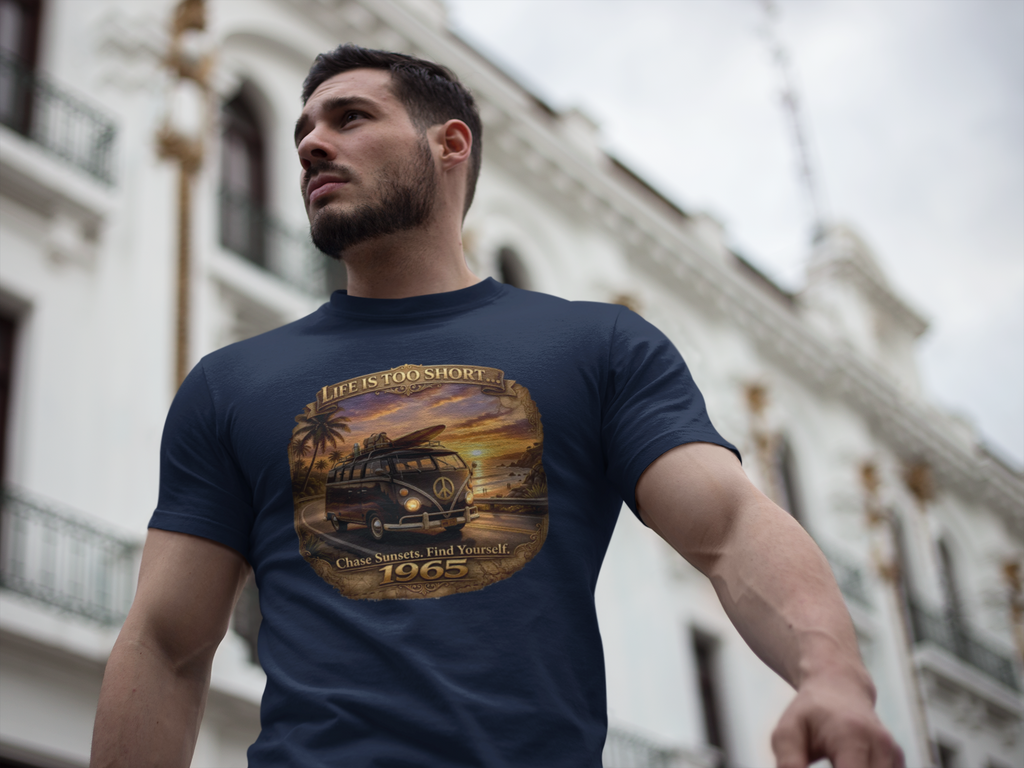Man wearing a navy blue t-shirt with a graphic 1965 van design in an urban setting