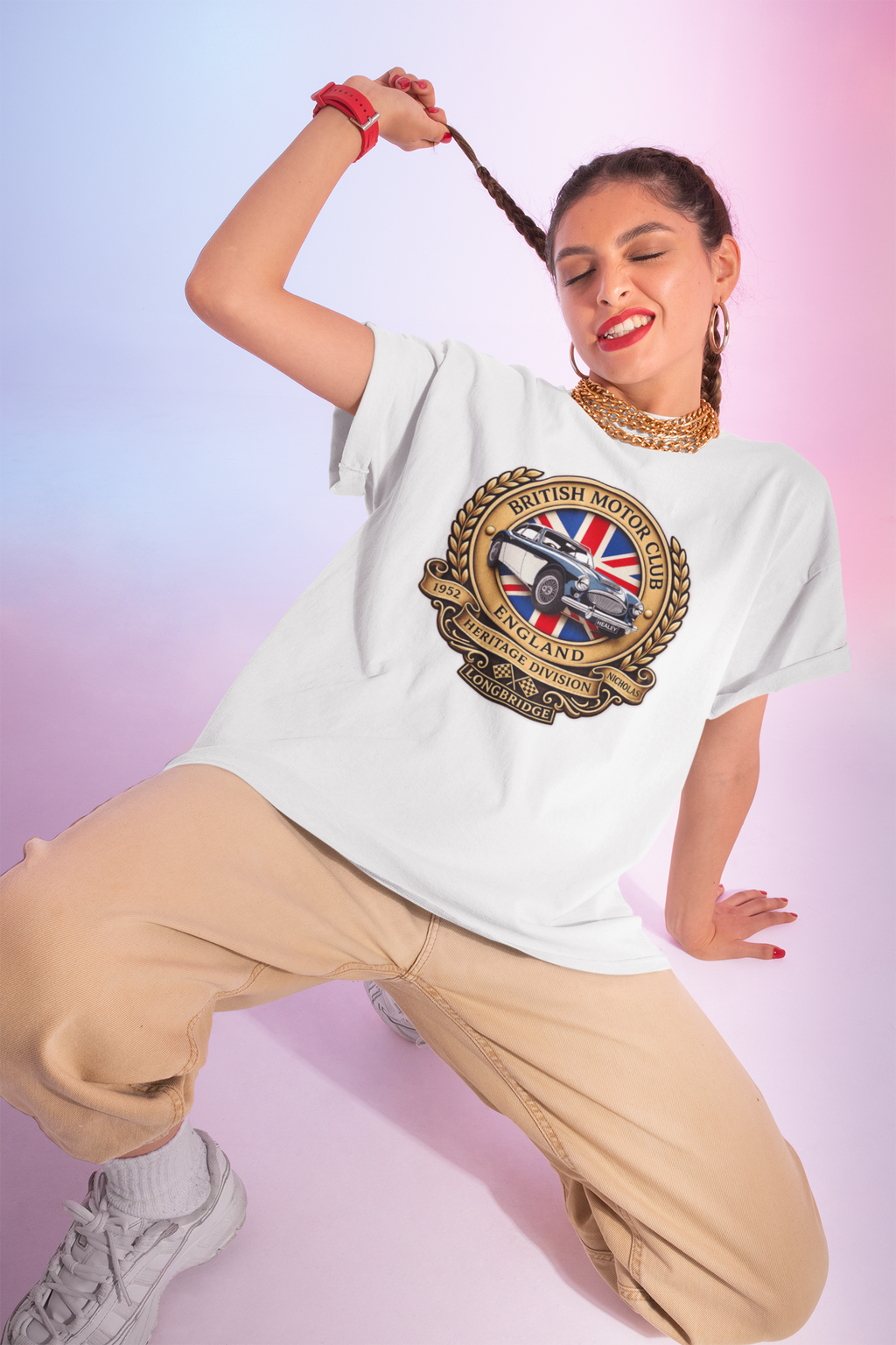 Woman wearing a white t-shirt with a graphic British Motor Club logo design on a gradient background