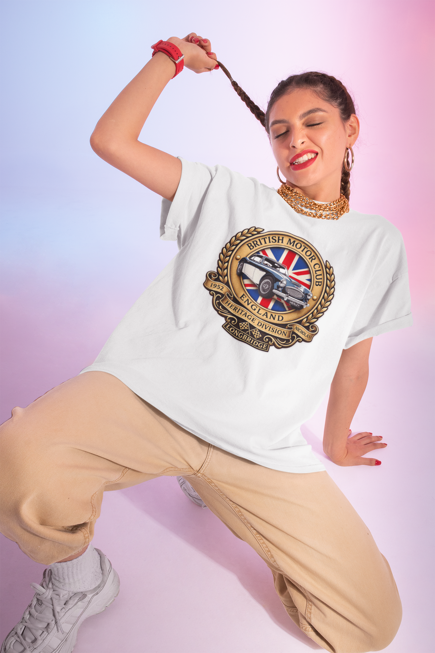 Woman wearing a white t-shirt with a graphic British Motor Club logo design on a gradient background