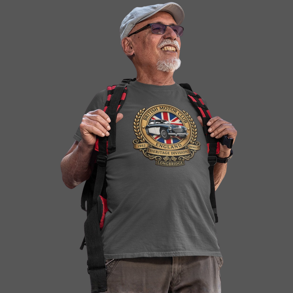 Man wearing a gray t-shirt with a British Motor Club logo and holding a backpack on a transparent background