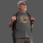 Man wearing a gray t-shirt with a British Motor Club logo and holding a backpack on a transparent background