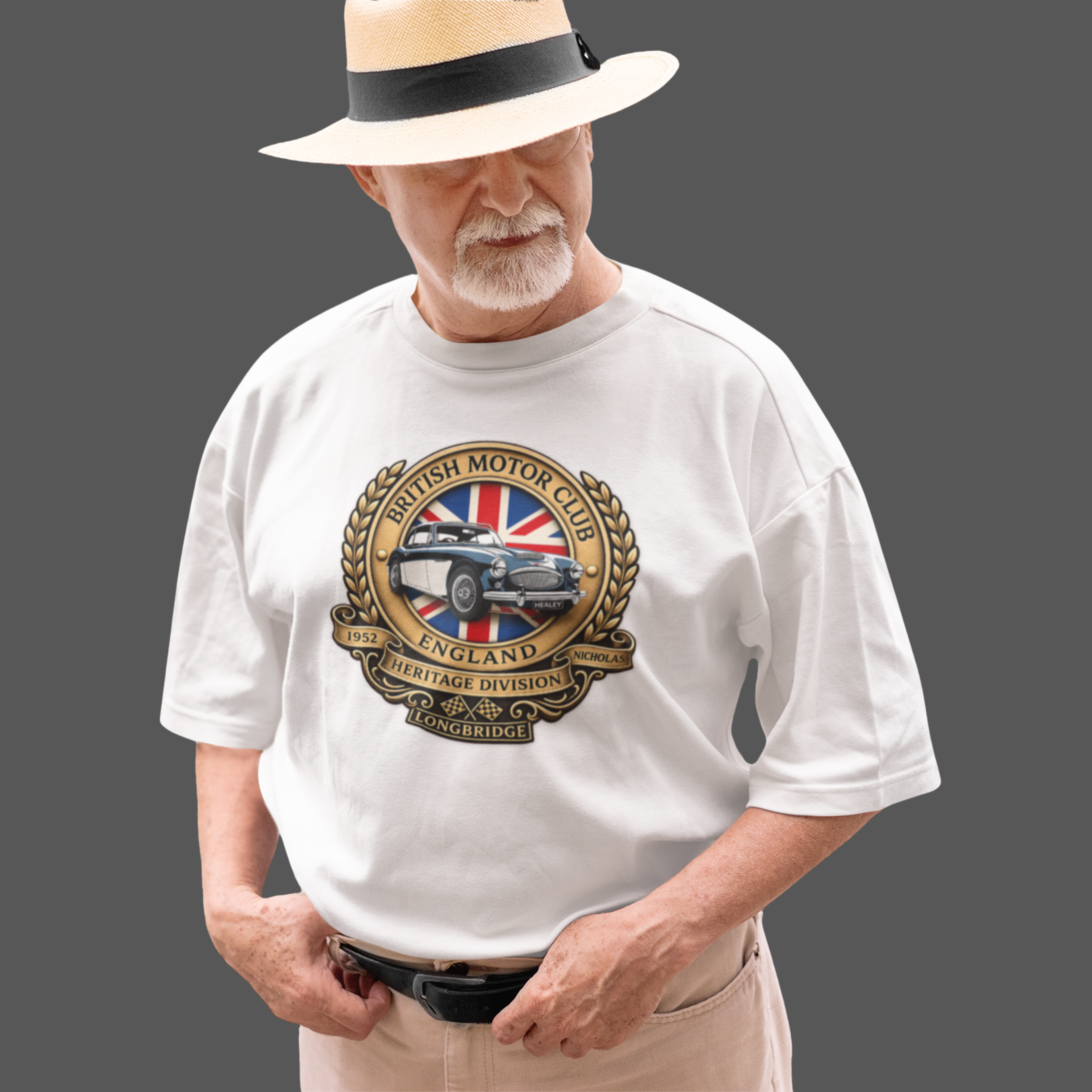 Man wearing a white t-shirt with a British Motor Club logo on a gray background