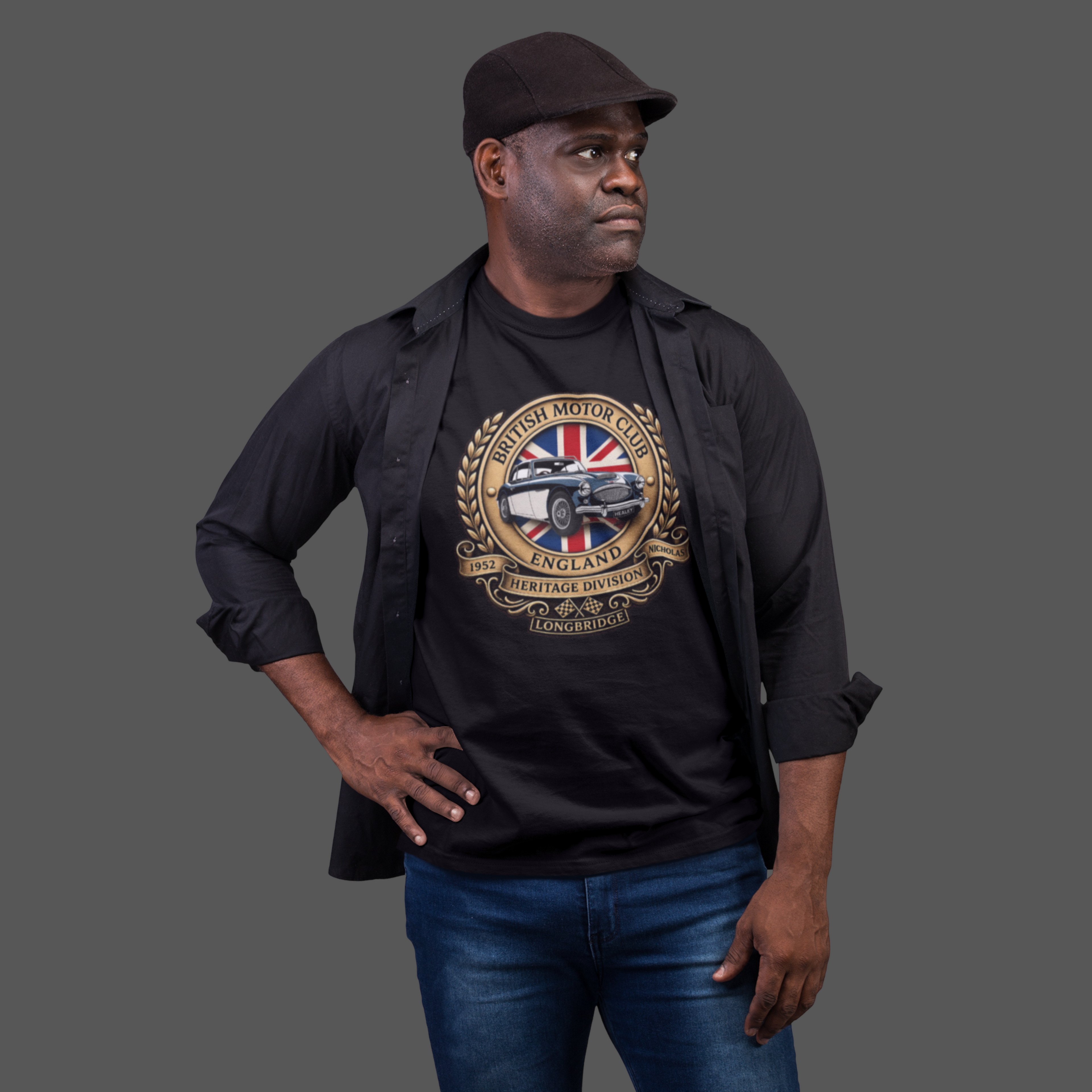 Man wearing a black t-shirt with a graphic British Motor Club logo design on a gray background