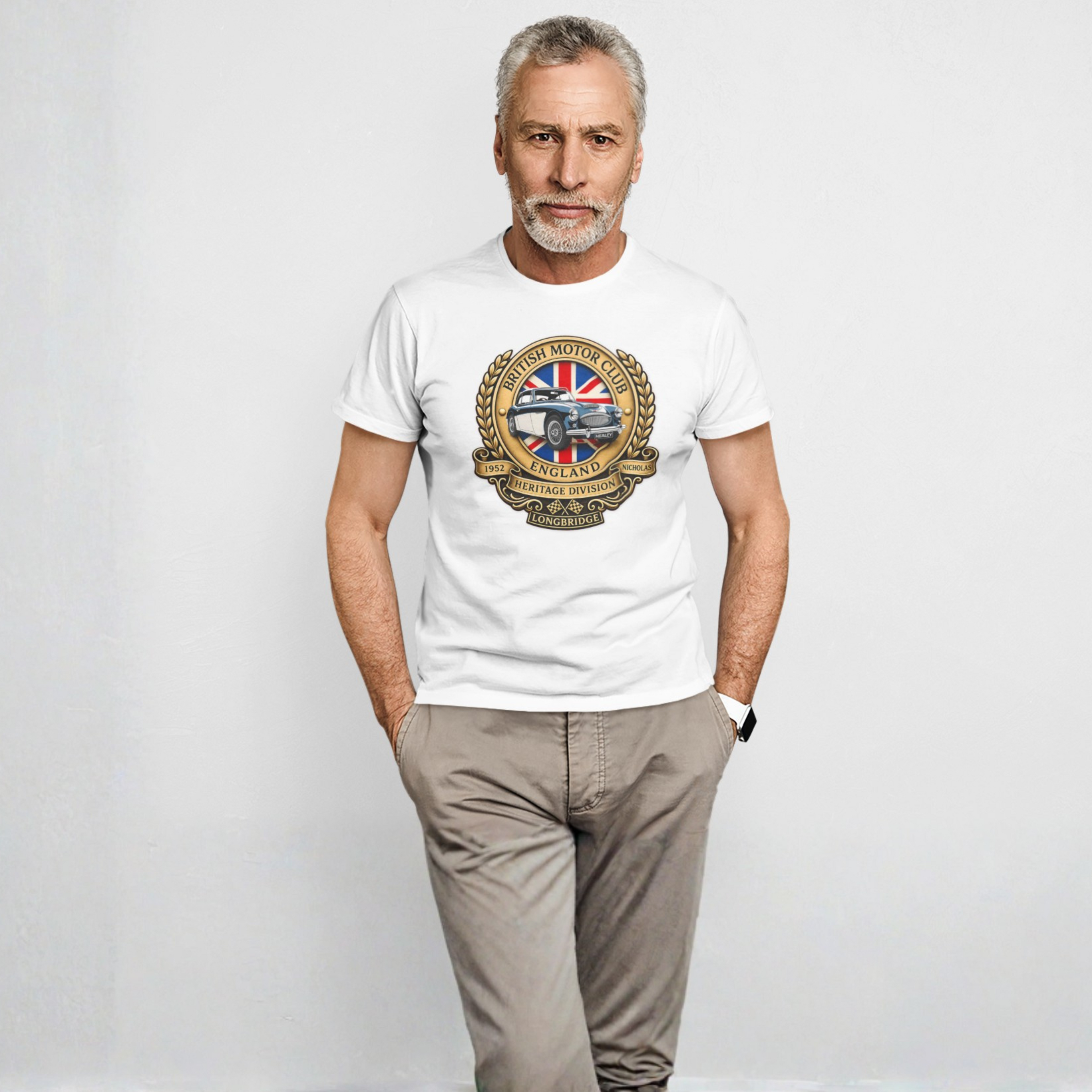 Man wearing a white t-shirt with a British Motor Club logo on a plain background