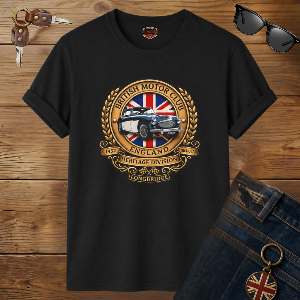 Black t-shirt with British Motor Club logo on a wooden surface with sunglasses and keys.