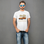 Man wearing a white t-shirt with a graphic 240Z design and text, standing against a gray background
