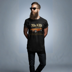 Man wearing a black t-shirt with '70s Kid' 240Z graphic design on a gray background