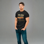 Man wearing a black t-shirt with '70s Kid' 240Z design on a gray background
