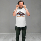 Man wearing a white t-shirt with a colorful car graphic and text, standing against a plain background.