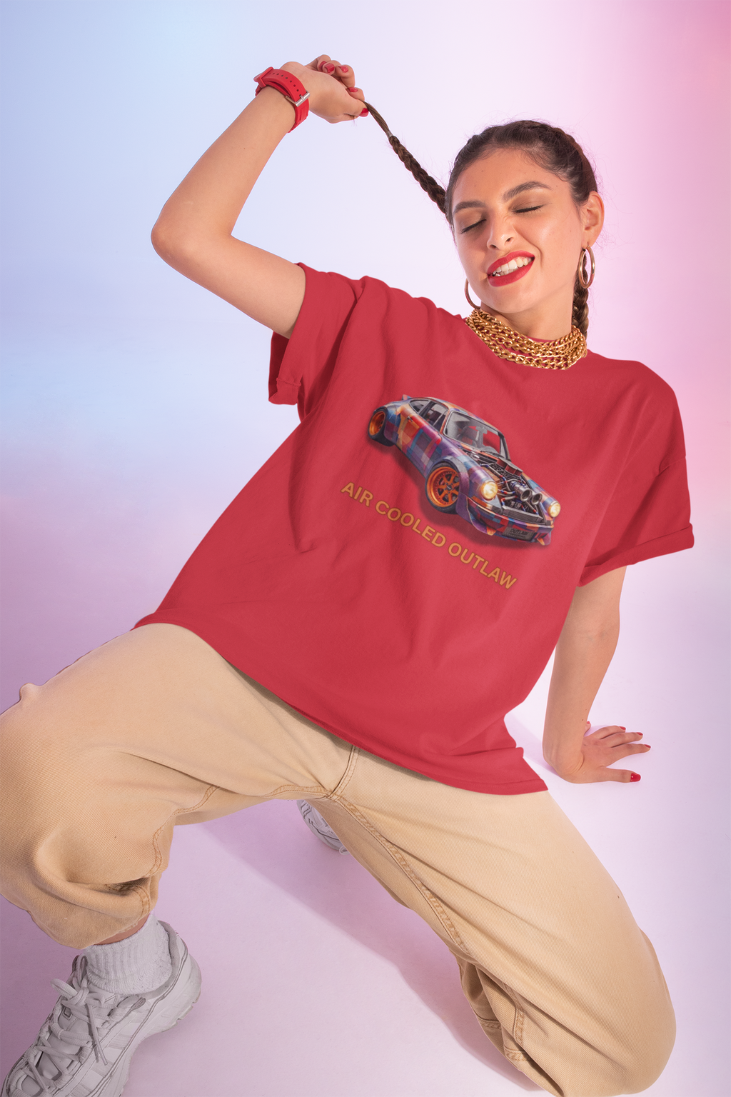 Woman wearing a red t-shirt with a graphic car design on a gradient background