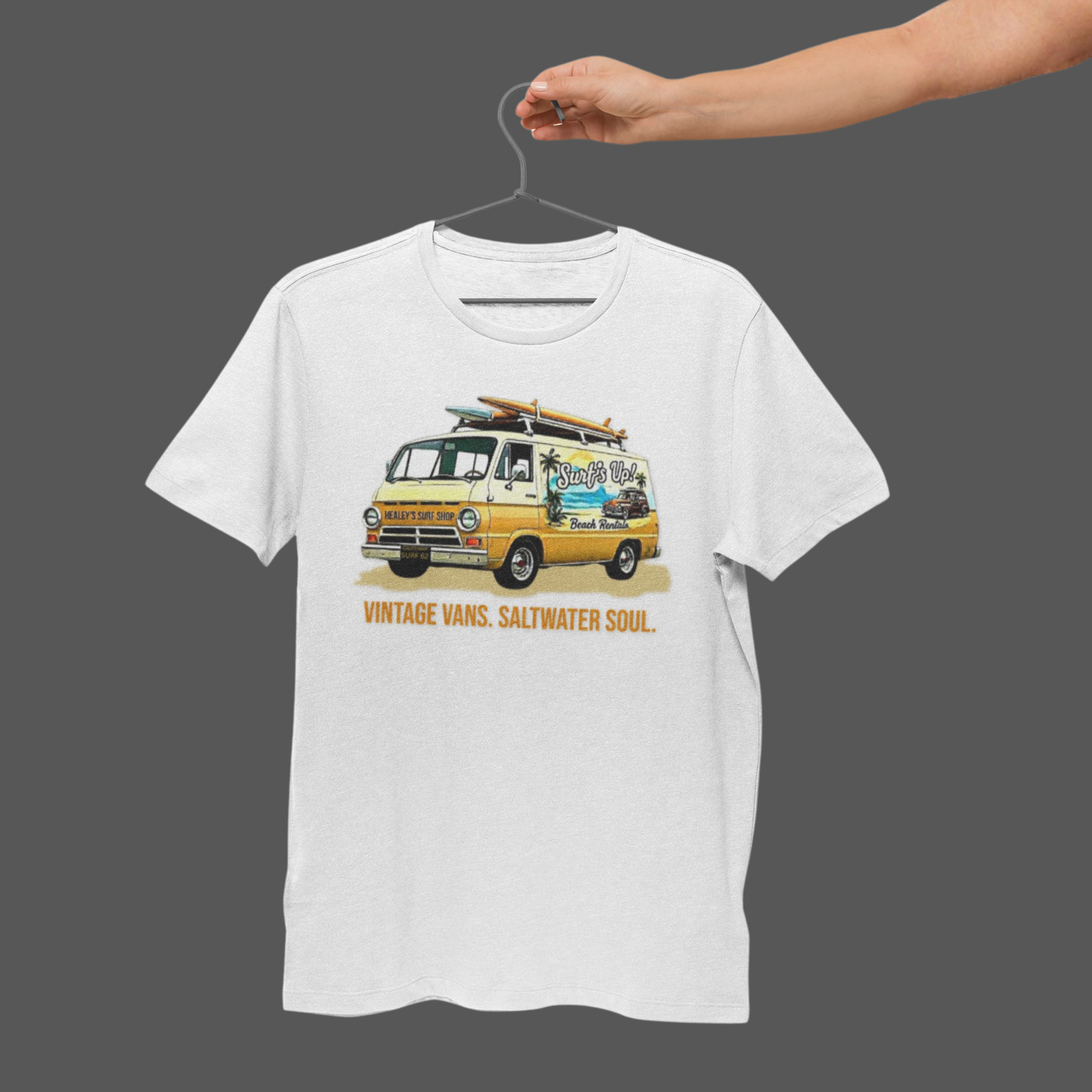 White t-shirt with a van graphic and text on a hanger against a gray background