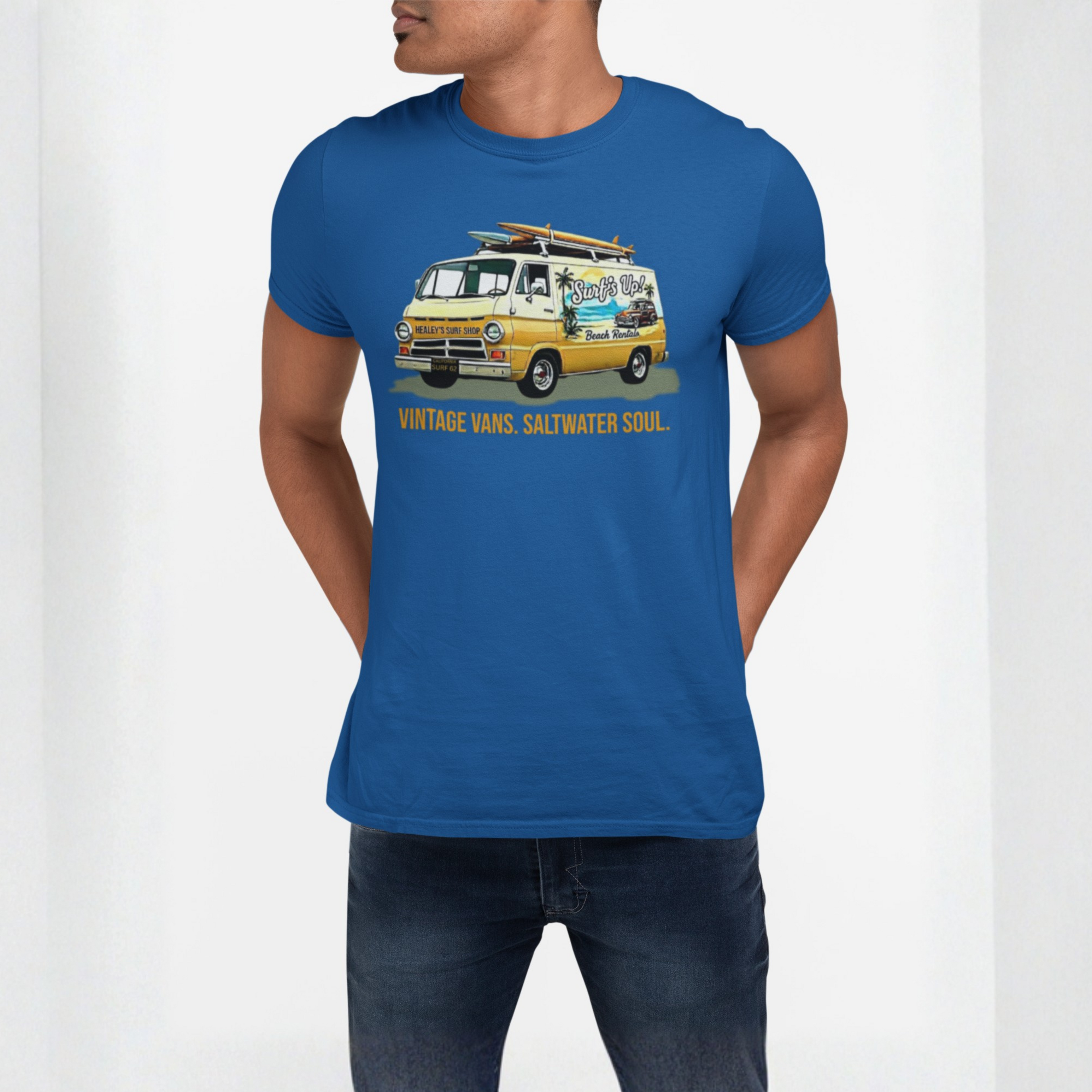 Man wearing a royal blue t-shirt with a vintage van graphic and text.