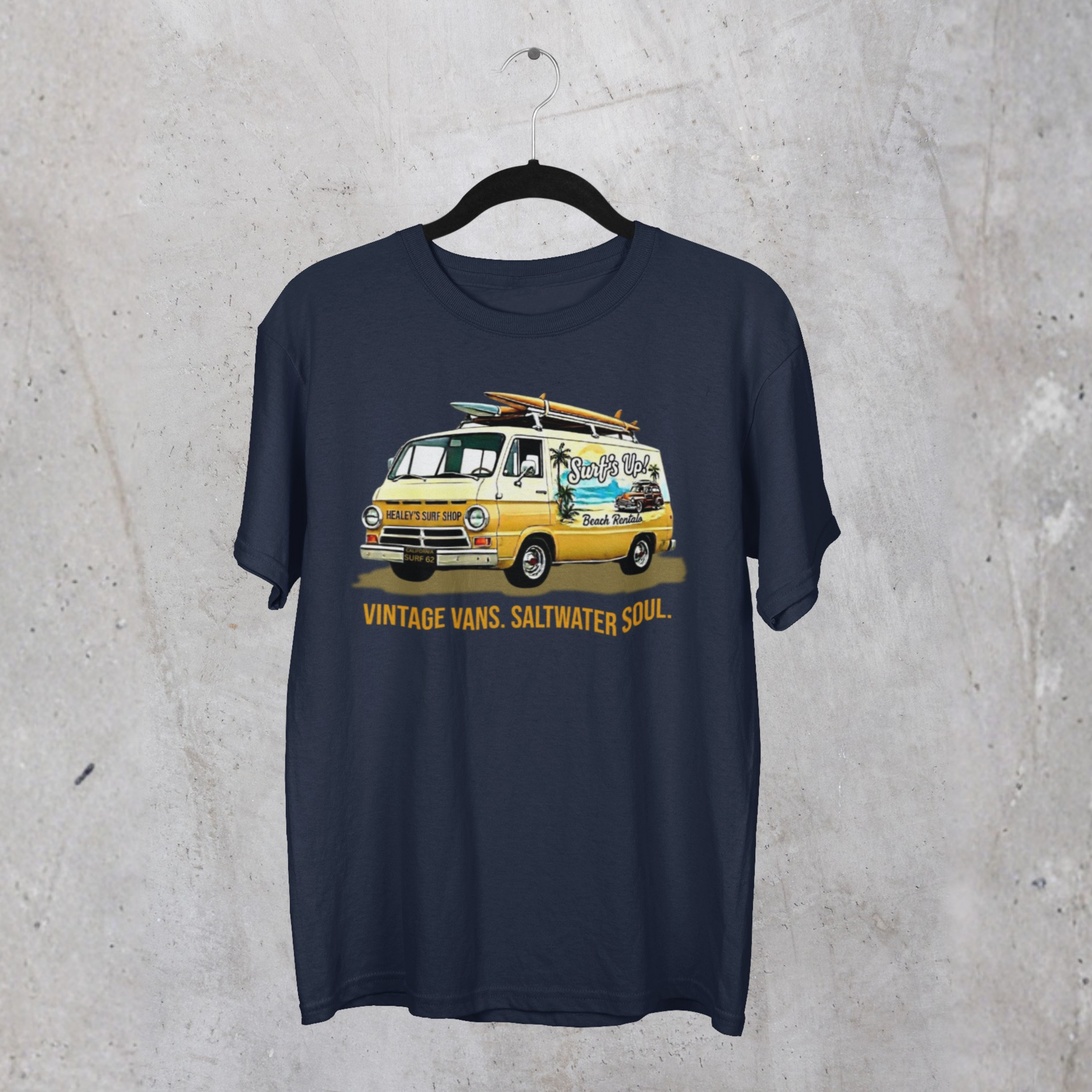 Navy blue t-shirt with a graphic of a classic van and text on a concrete surface