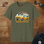 Military green t-shirt with a van graphic and text on a wooden surface with sunglasses and keys.