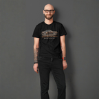 Man wearing a black t-shirt with a classic car graphic design on a gray background