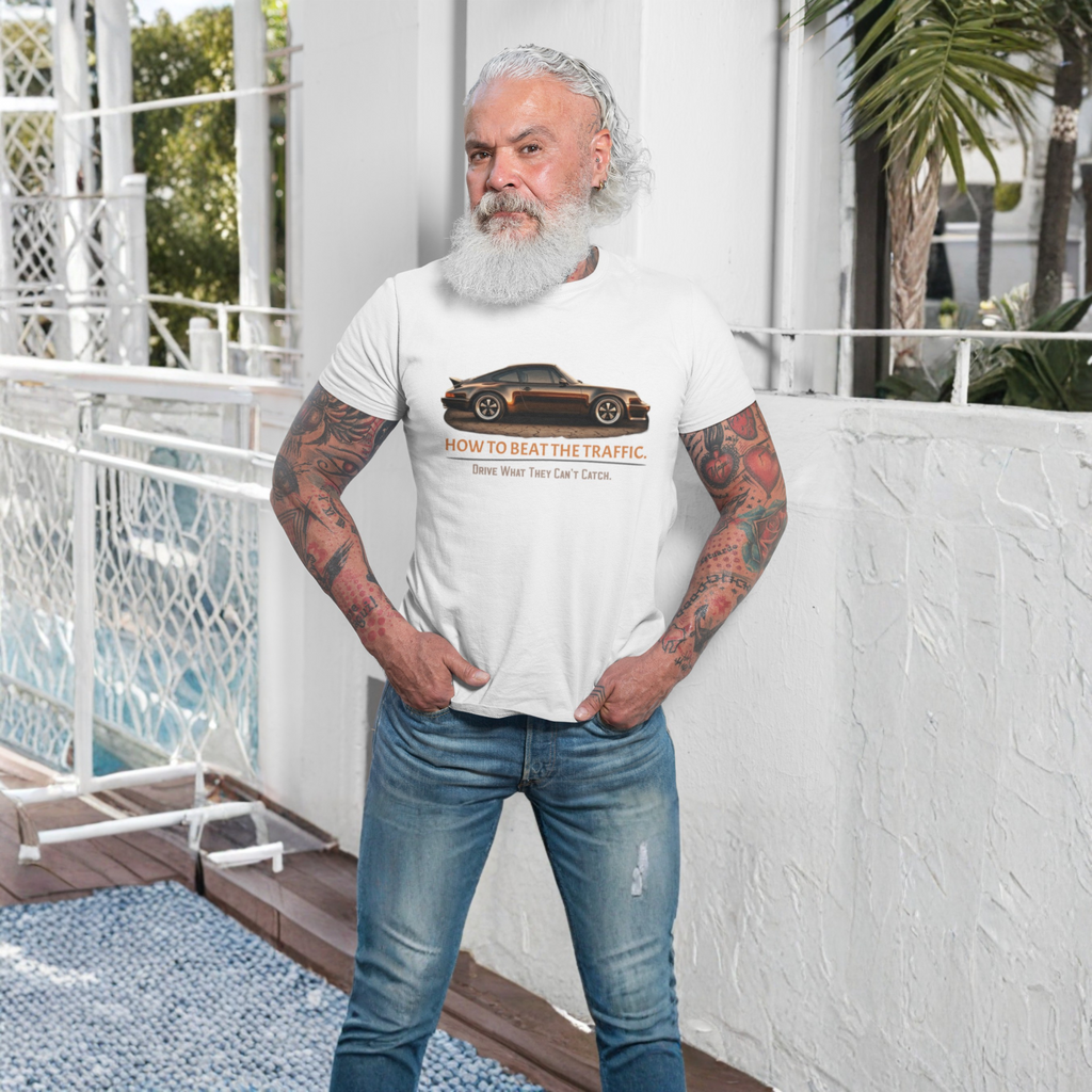 Man wearing a white t-shirt with a classic car graphic design, standing on a balcony.