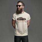 Man wearing a t-shirt with a classic car graphic design on a gray background