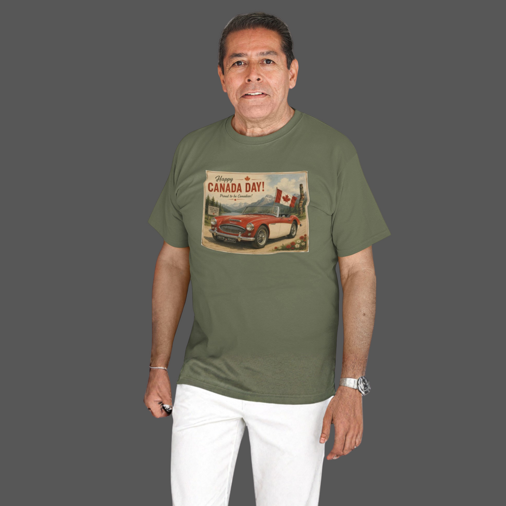 A man wearing an military green t-shirt with a vintage-style 'Canada Day!' graphic print featuring a red car and Canadian flag, paired with white pants, set against a solid dark gray background.