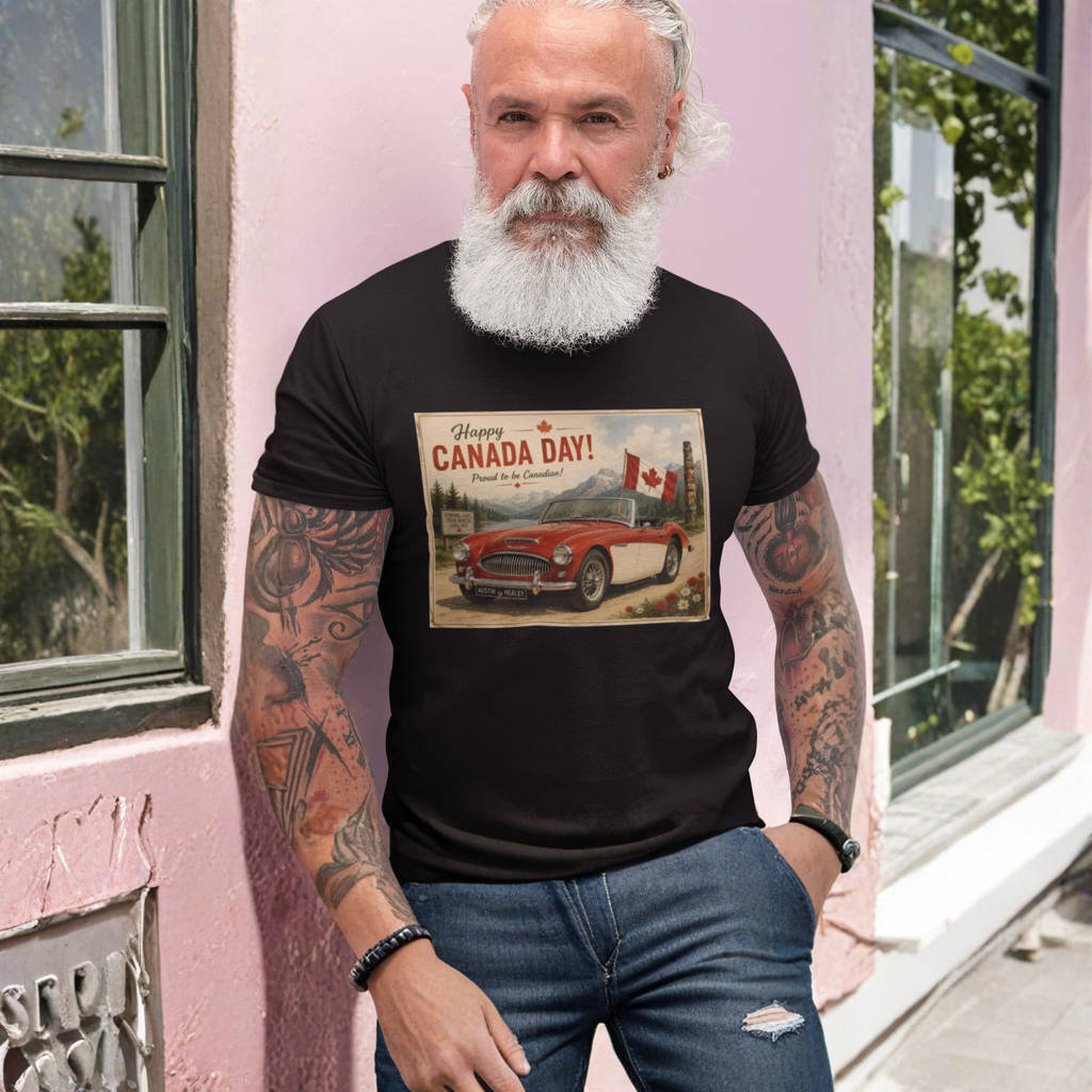 Man wearing a black crewneck t-shirt featuring a vintage-style 'Happy Canada Day!' graphic print on the chest, showing a red convertible car and a Canadian flag, standing against a pink wall.