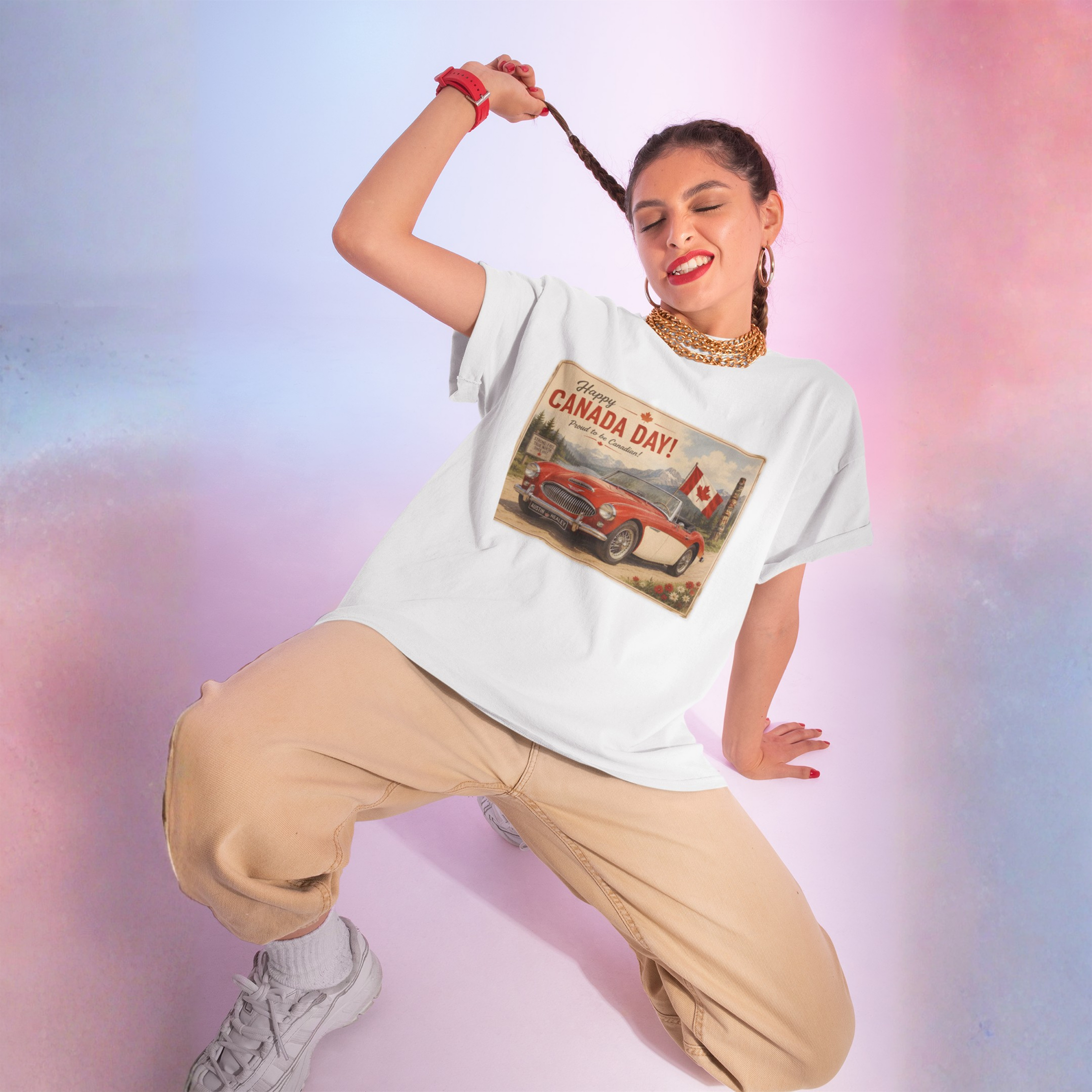Girl wearing a white crewneck t-shirt featuring a vintage-style 'Happy Canada Day!' graphic print on the chest, showing a red convertible car and a Canadian flag.