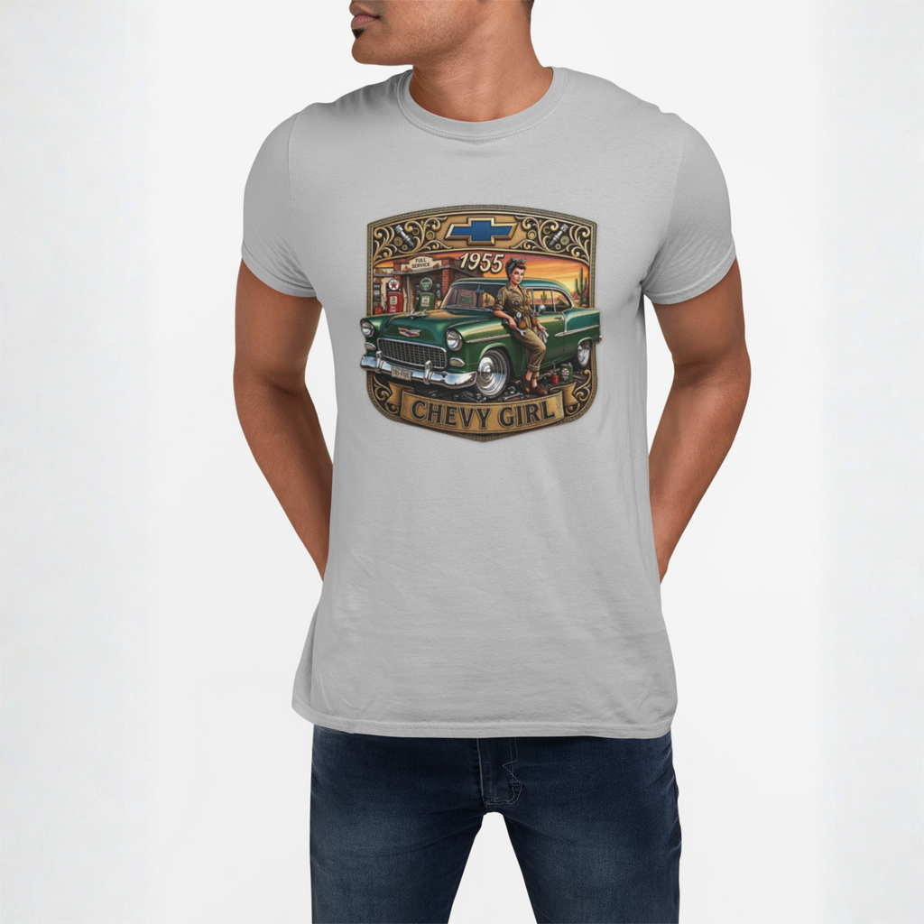 A man wearing a sport gray crewneck t-shirt with a vintage-style graphic of a green 1959 Chevy truck and a woman, paired with dark blue jeans, against a plain light gray background.