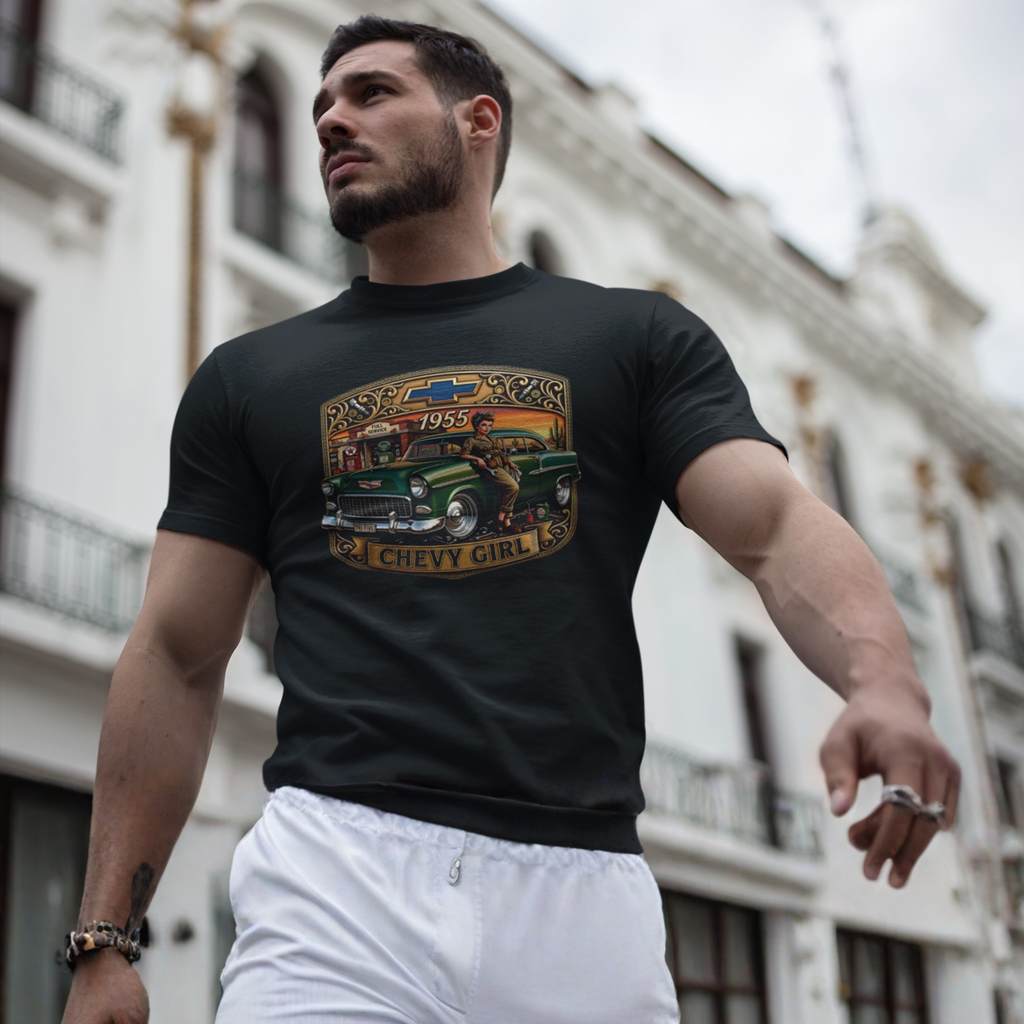 A muscular man wearing a black graphic t-shirt with a vintage green Chevrolet truck print and white sweatpants, standing in front of a blurred white building.