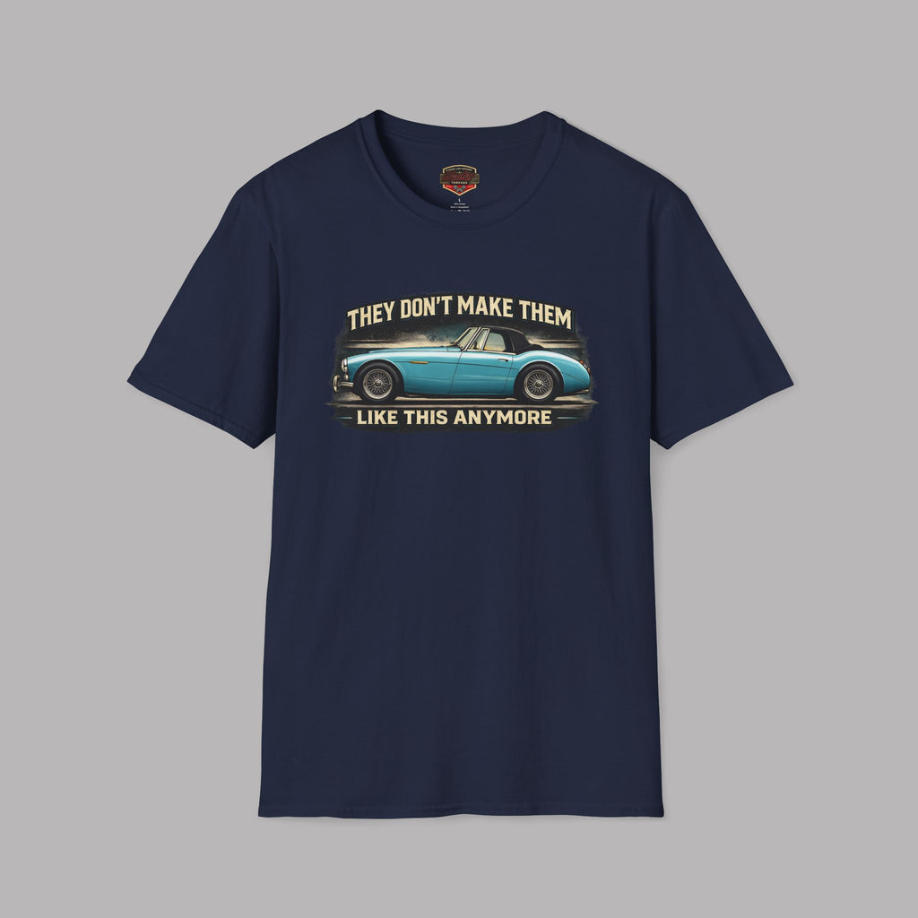 Navy blue t-shirt with vintage car graphic and text on a gray background