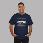 Man wearing a navy blue t-shirt with a classic car graphic design and text on a gray background