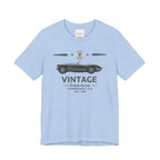 Light blue t-shirt with vintage car graphic and text on a white background