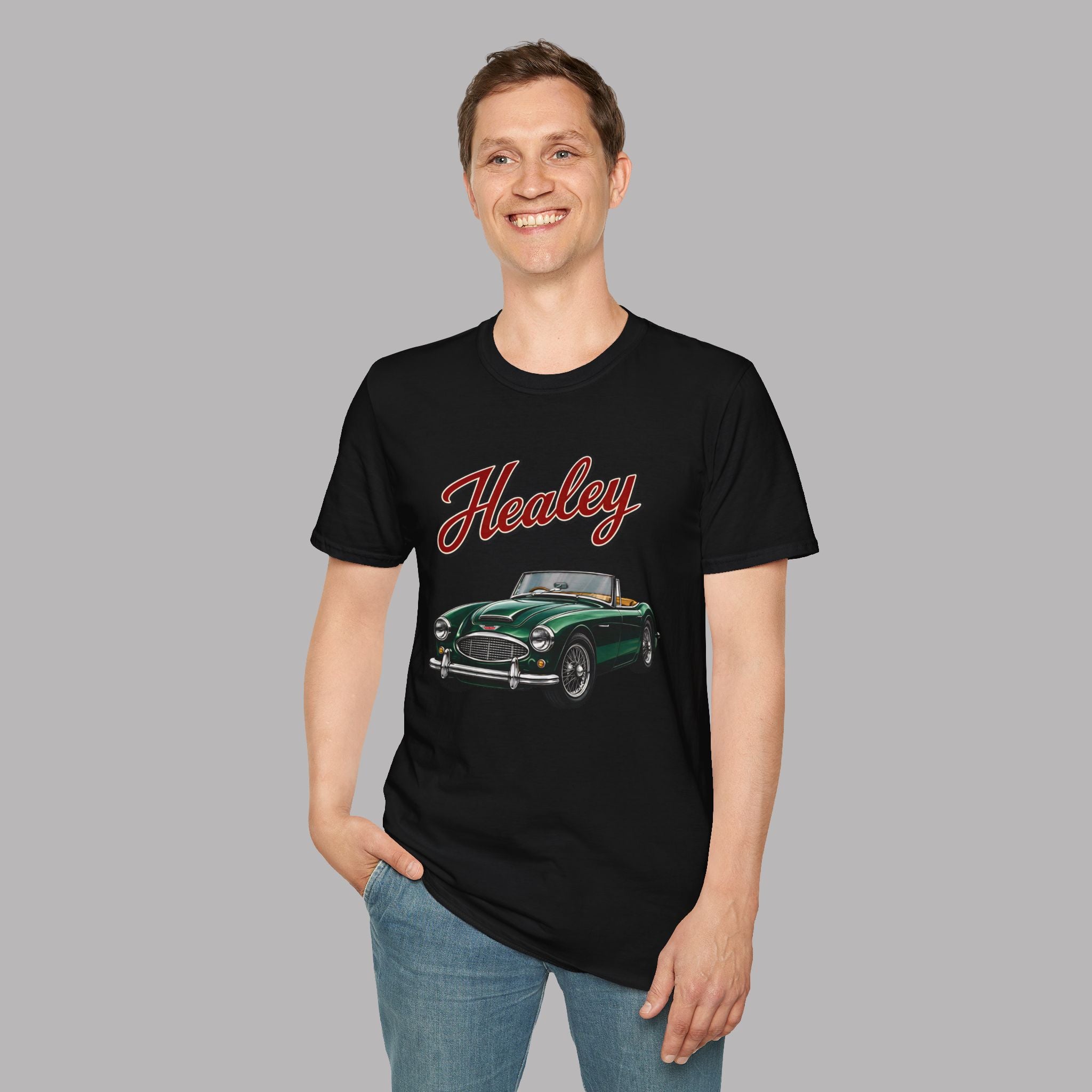 Man wearing a black t-shirt with a green classic car graphic and 'Healey' text on a gray background