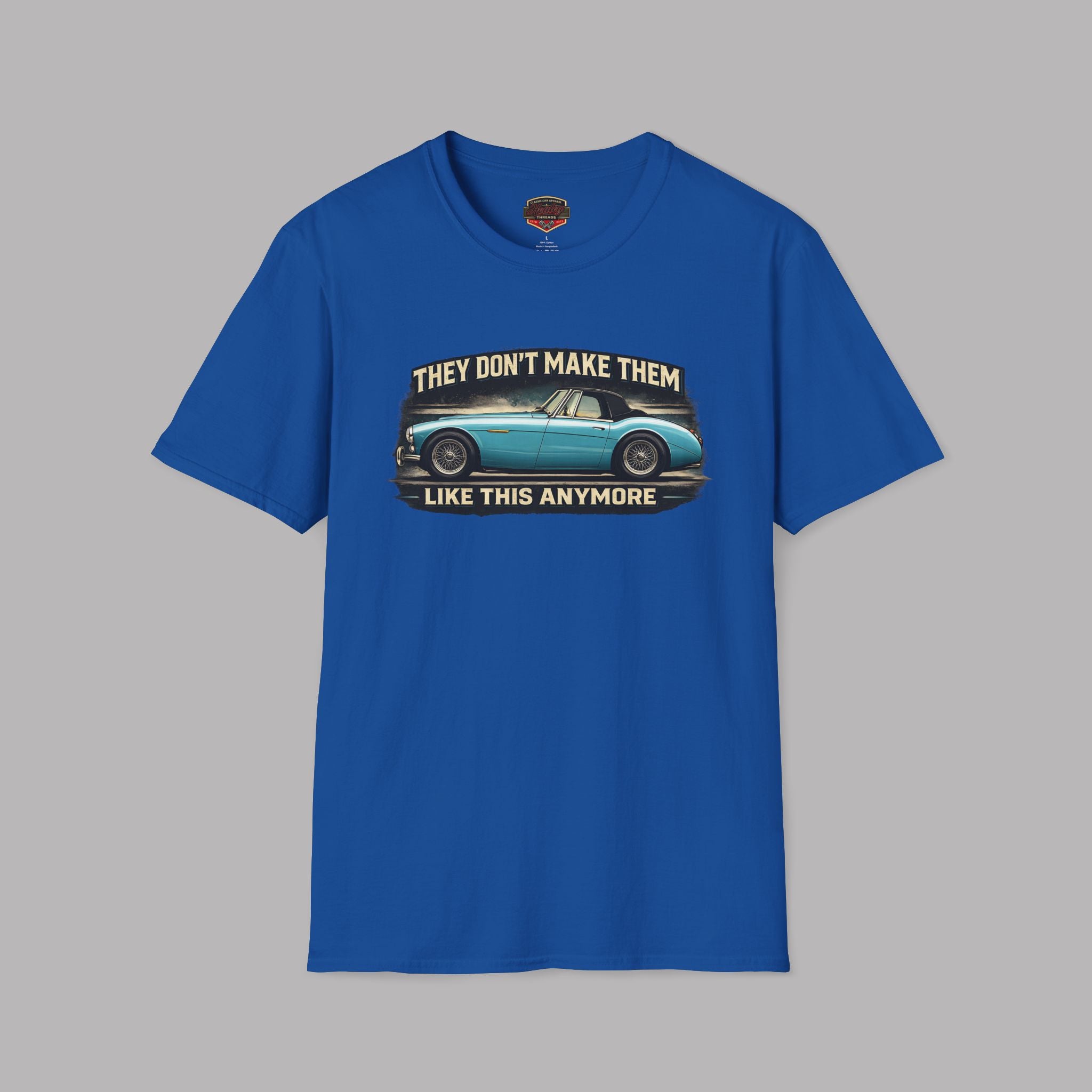Royal blue t-shirt with graphic of a classic  Healey car and text on a gray background