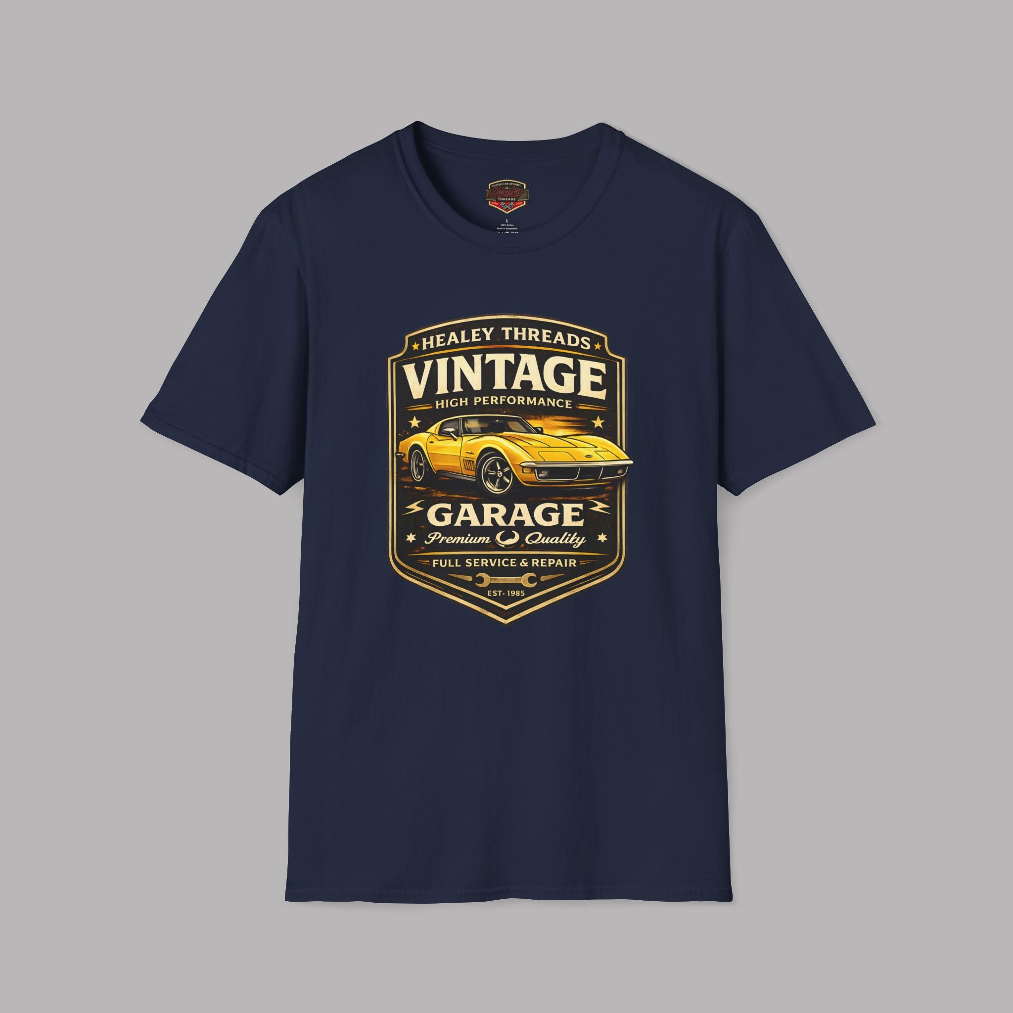 Navy blue t-shirt with vintage classic car graphic on a gray background