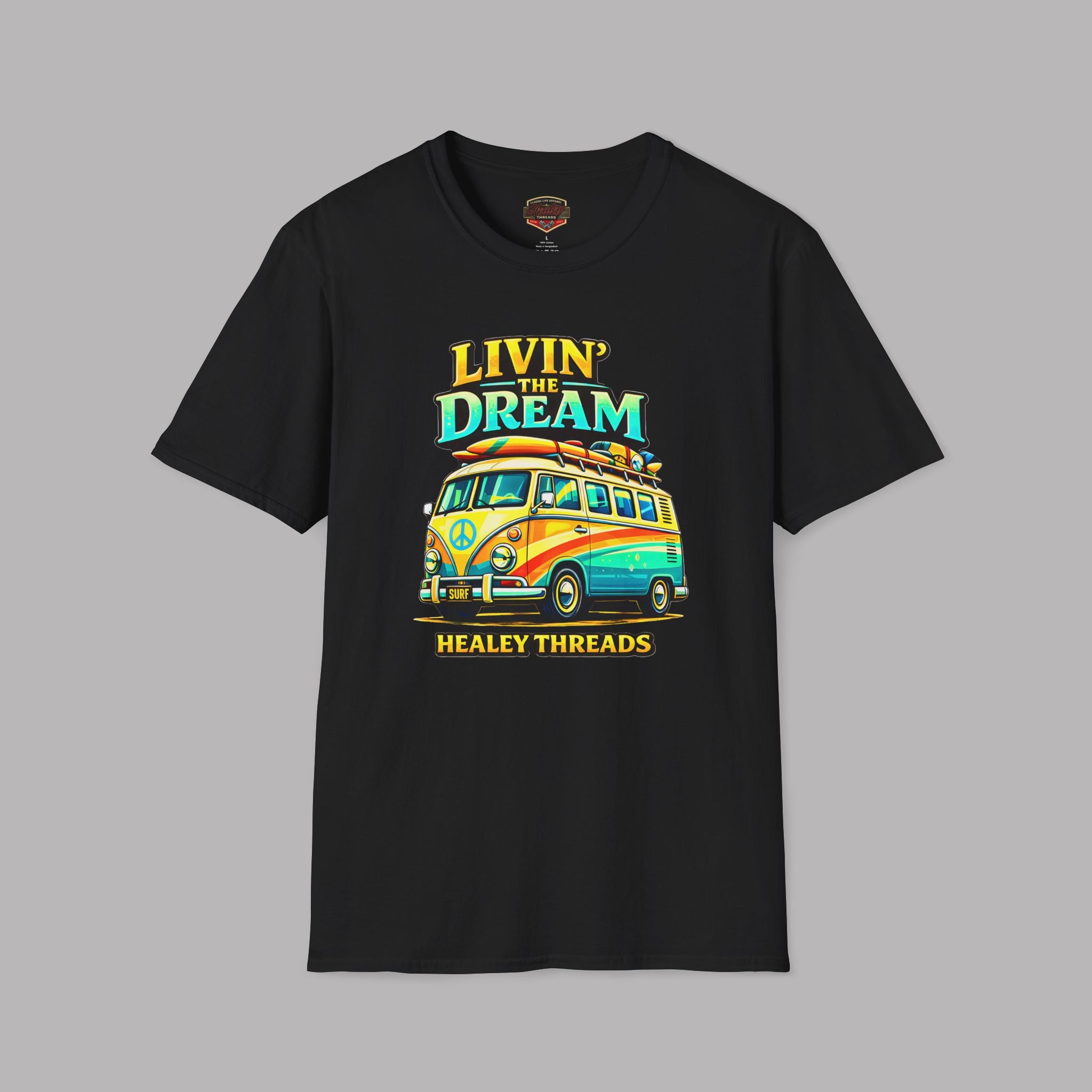 Black t-shirt with a colorful graphic of a van and text 'Livin' the Dream' on a gray background