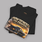 Folded black t-shirt with classic car graphic and text on a gray background