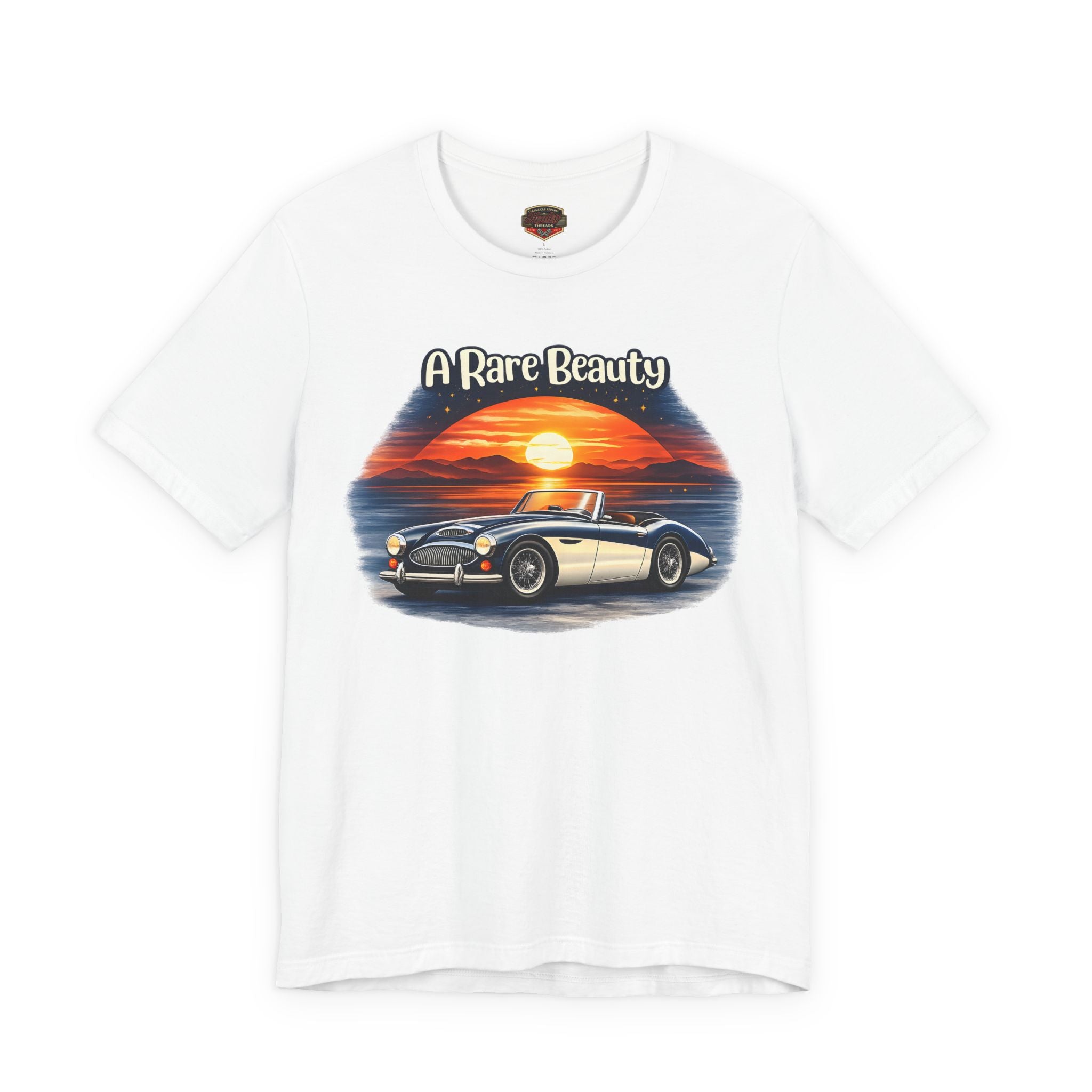 White t-shirt with a graphic of a Healey car and sunset design on a white background