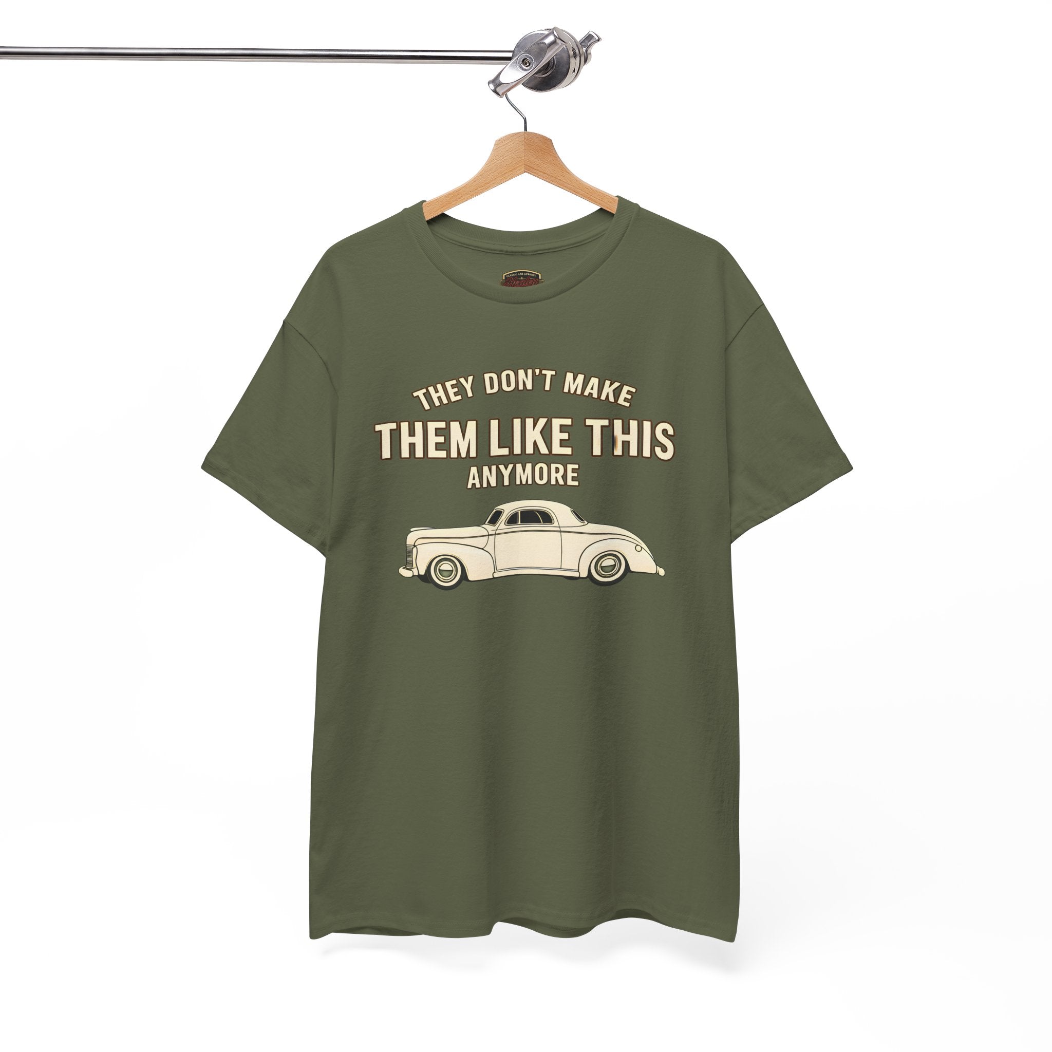 Military green t-shirt with a graphic and text on a hanger against a white background