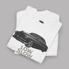 Folded white t-shirt with black car graphic and 'LOW SLOW' text on a gray background