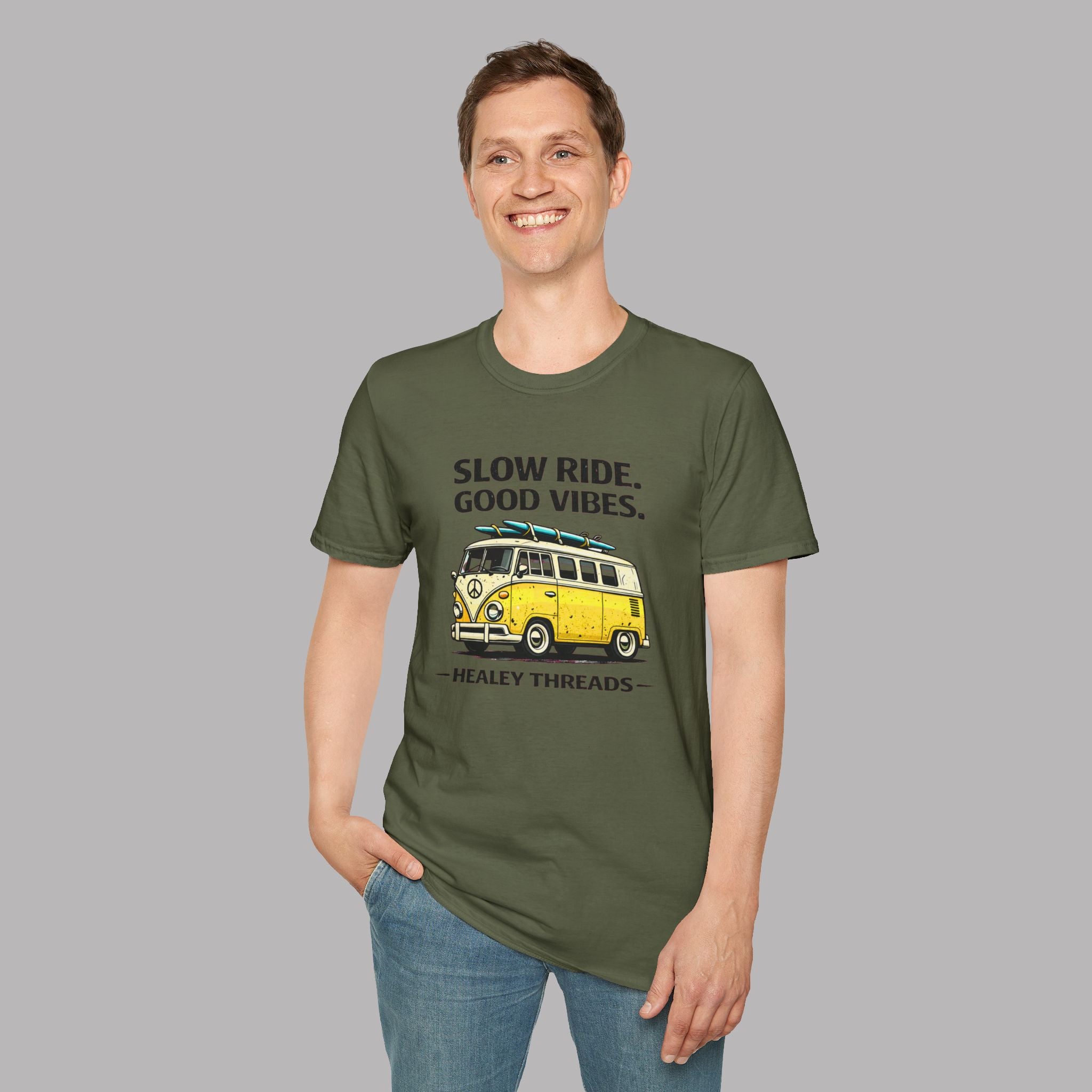 Man wearing a military green t-shirt with a yellow van graphic and text on a gray background