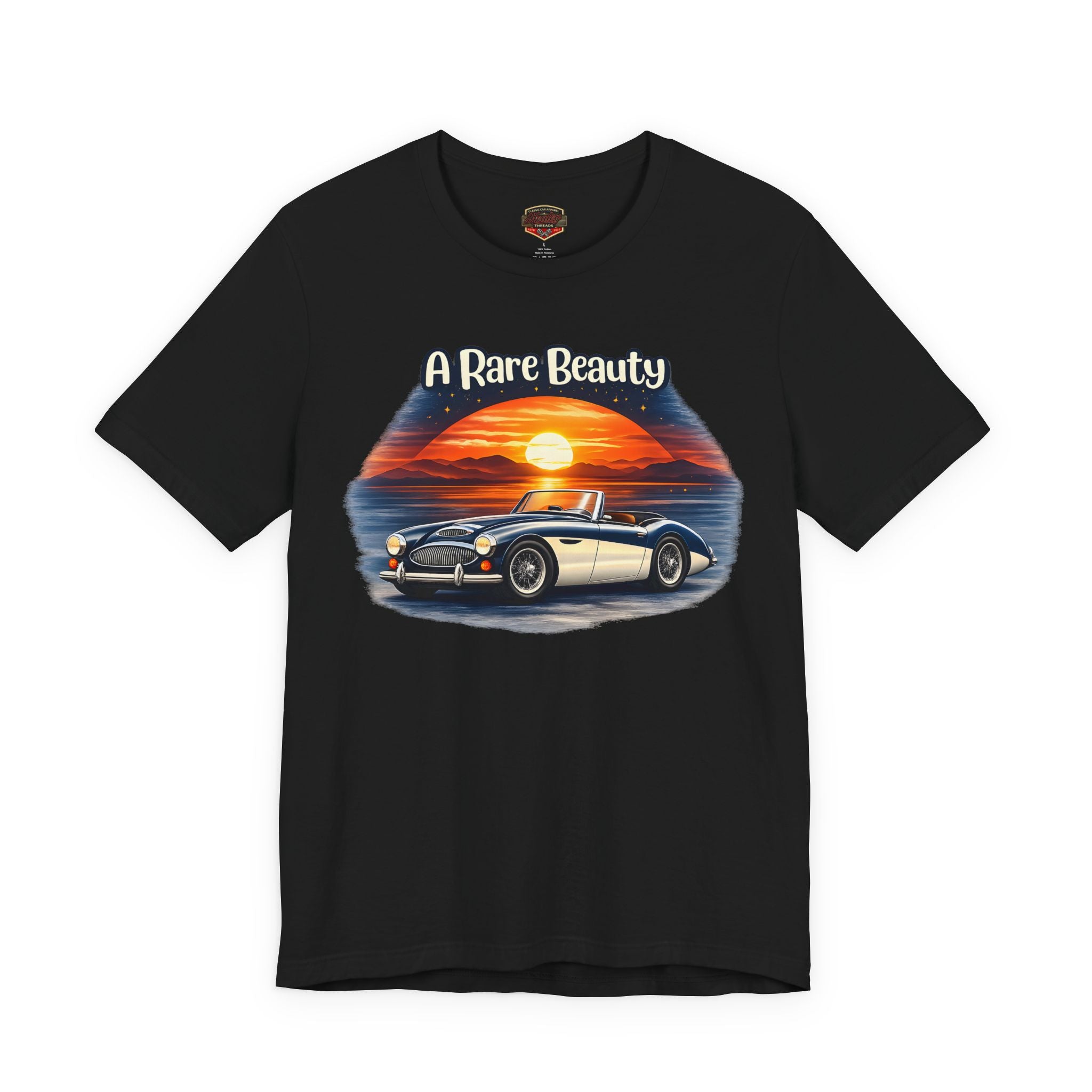 Black t-shirt with a graphic of a vintage Healey car and sunset, labeled 'A Rare Beauty', on a white background.