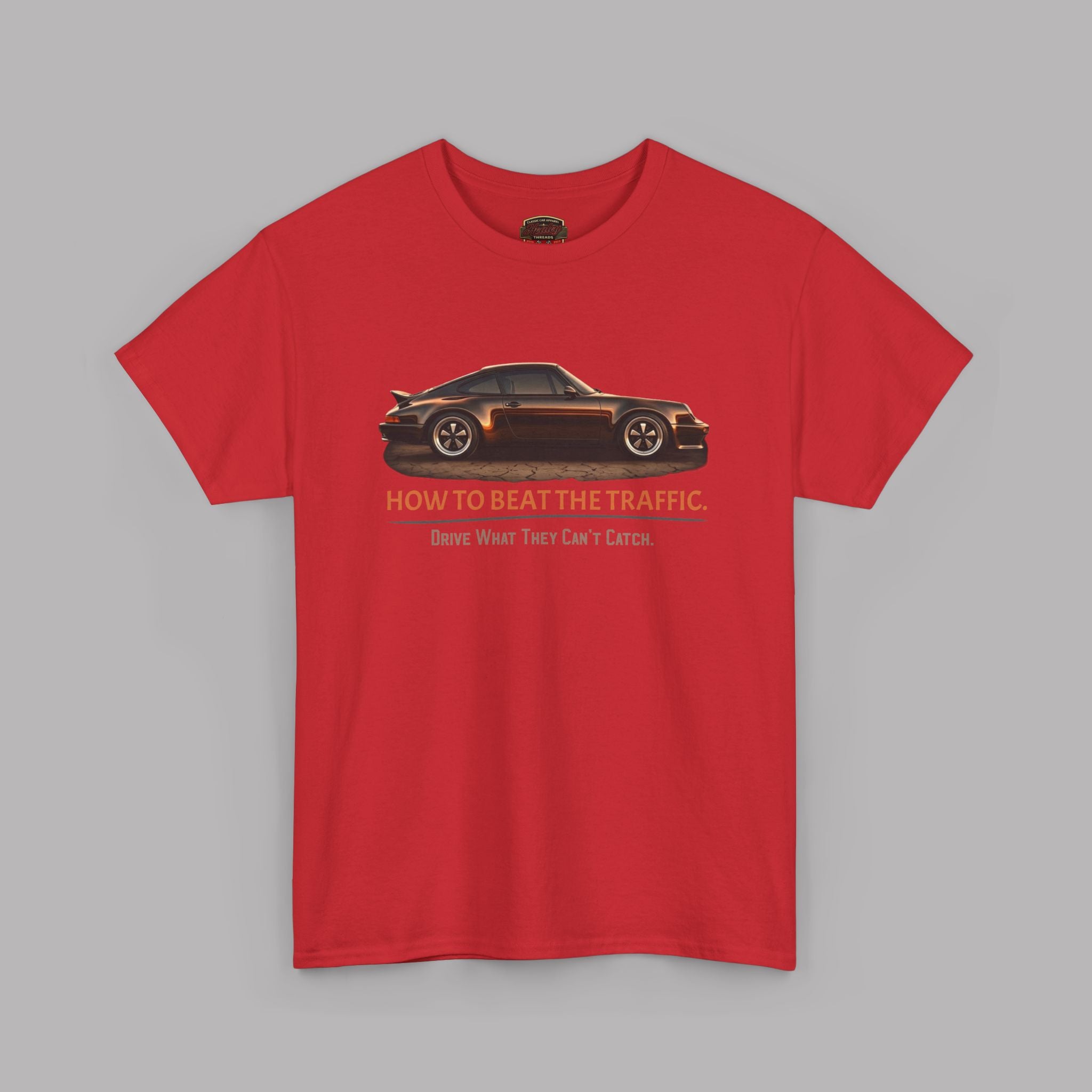 Red t-shirt with a car graphic and text on a gray background