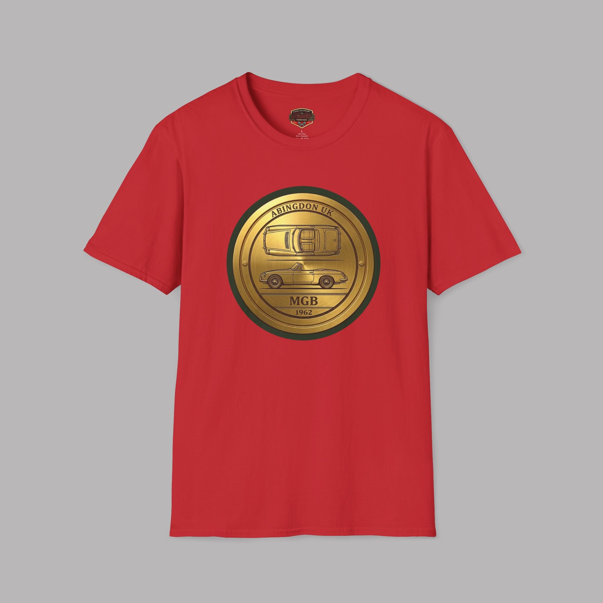 Red t-shirt with a gold classic car emblem on a gray background