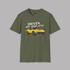 Military green t-shirt with a yellow muscle car graphic and text 'Driven. Not Displayed.' on a gray background