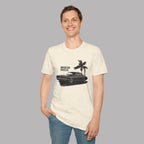 Man wearing a white t-shirt with a graphic design of a car and palm trees on a plain background