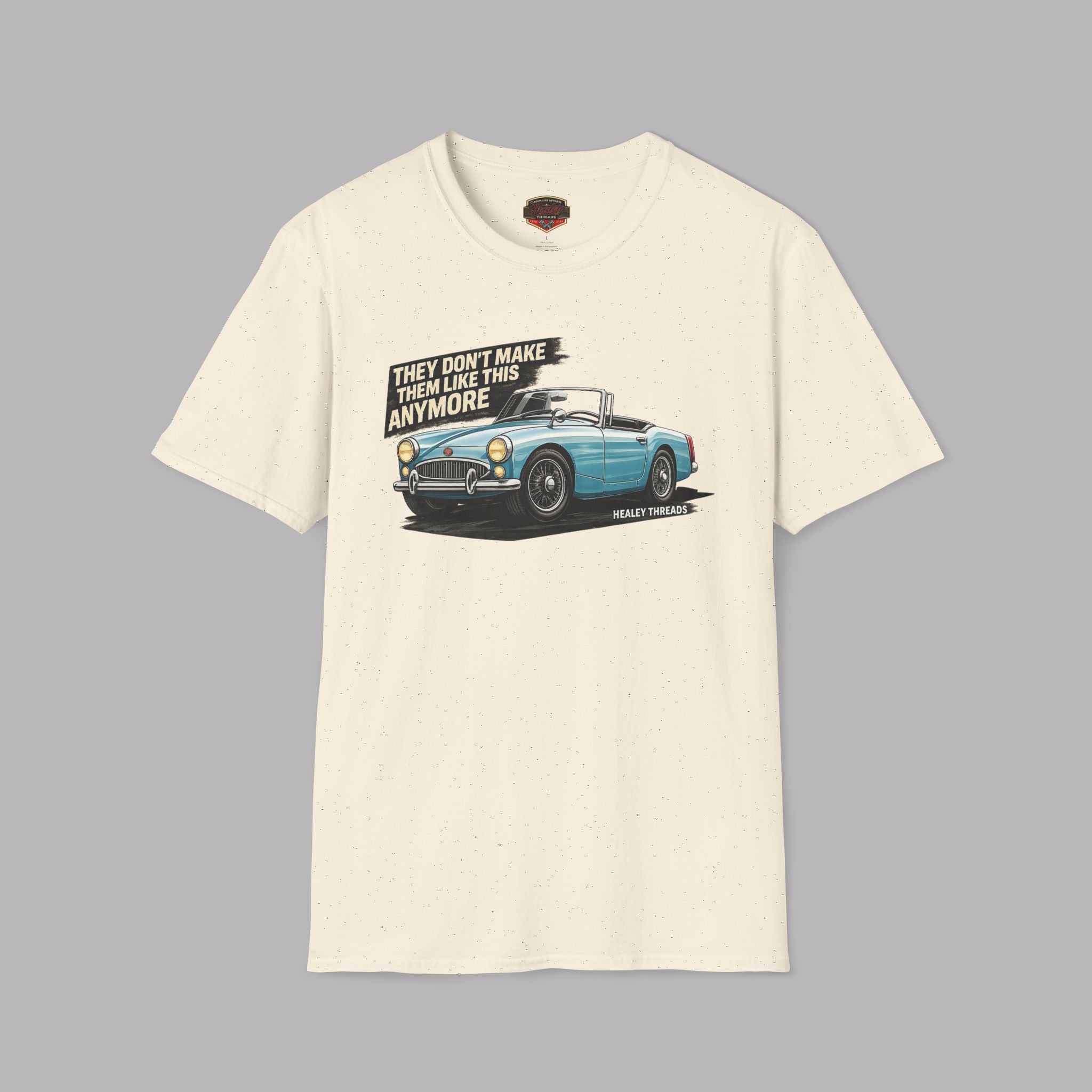 Natural t-shirt with a graphic of a blue vintage car and text on a gray background