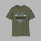 Military green t-shirt with vintage car graphic and text on a gray background