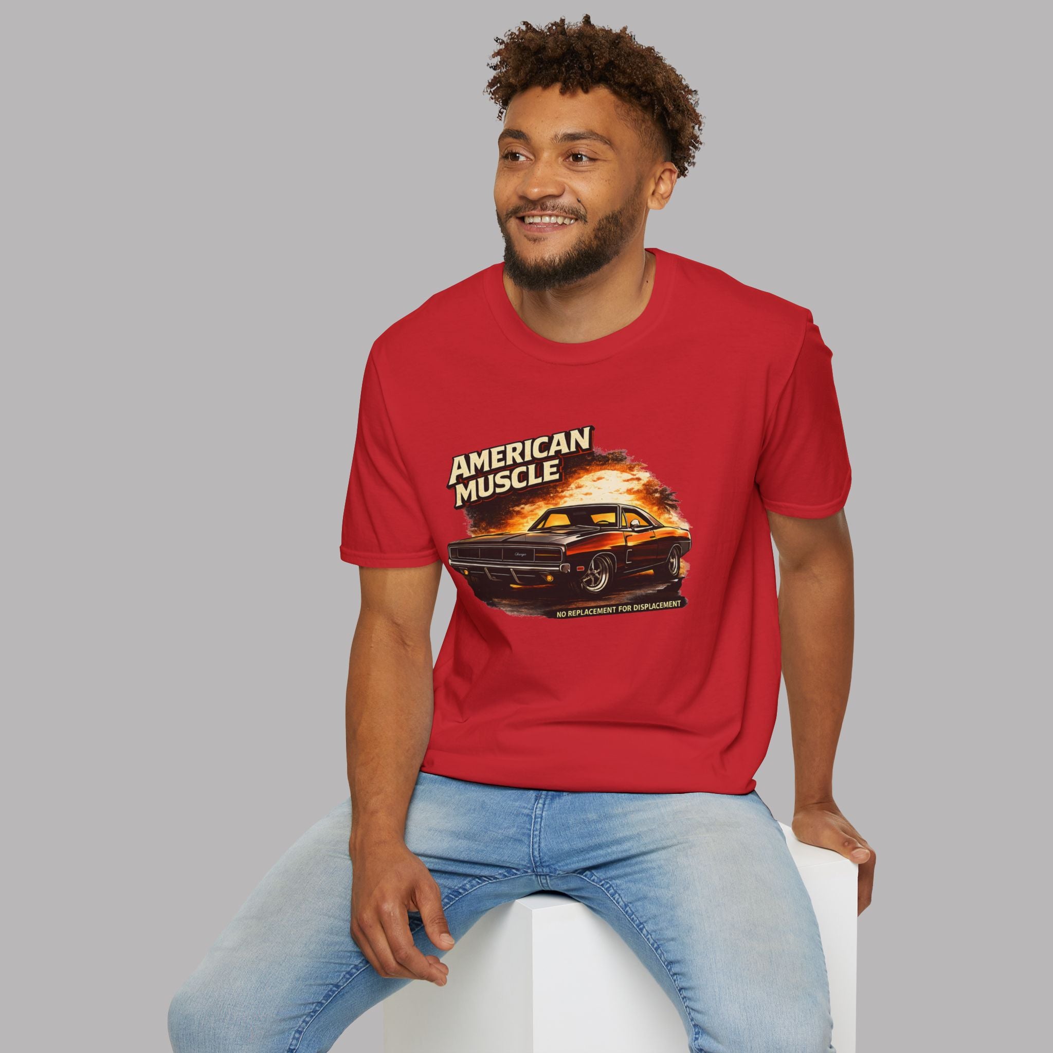 Man wearing a red t-shirt with 'American Muscle' graphic design on a gray background