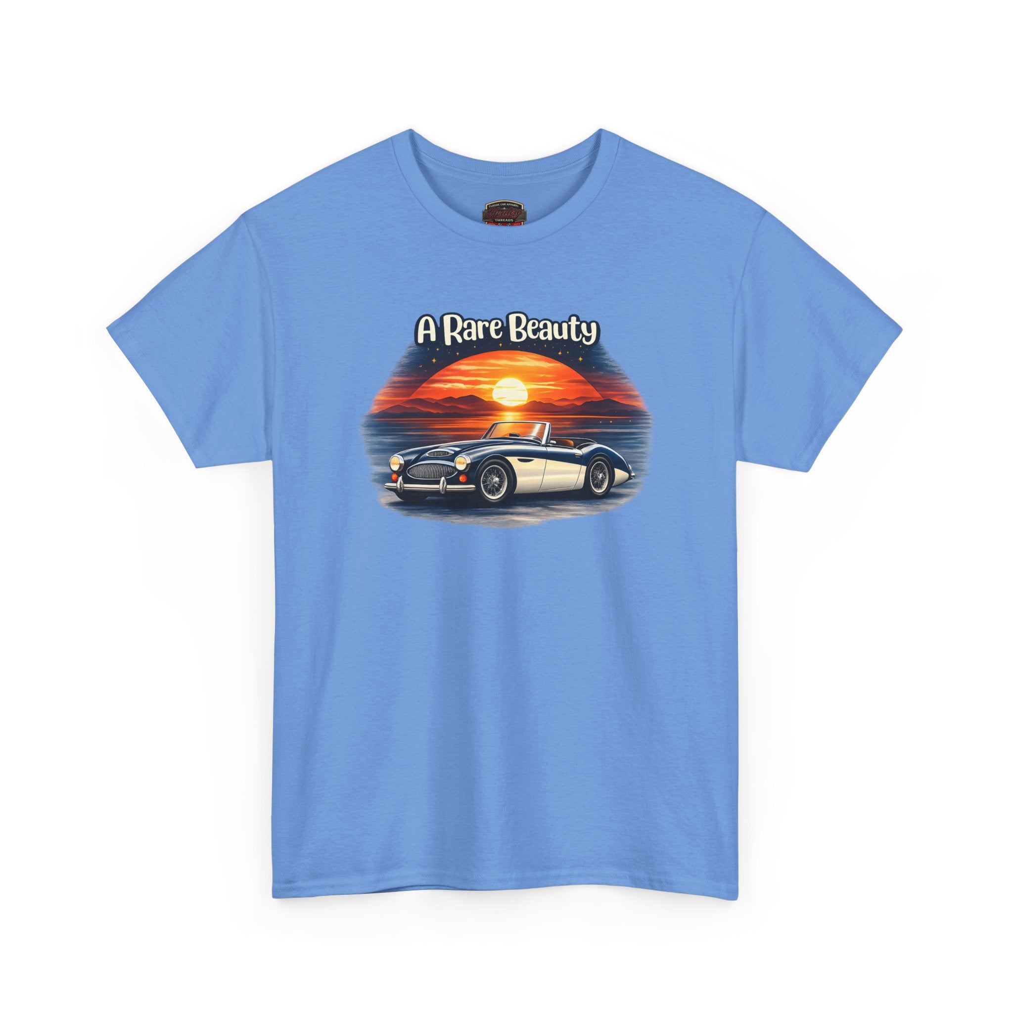 Carolina blue t-shirt with a graphic of a car and sunset, labeled 'A Rare Beauty', on a white background.