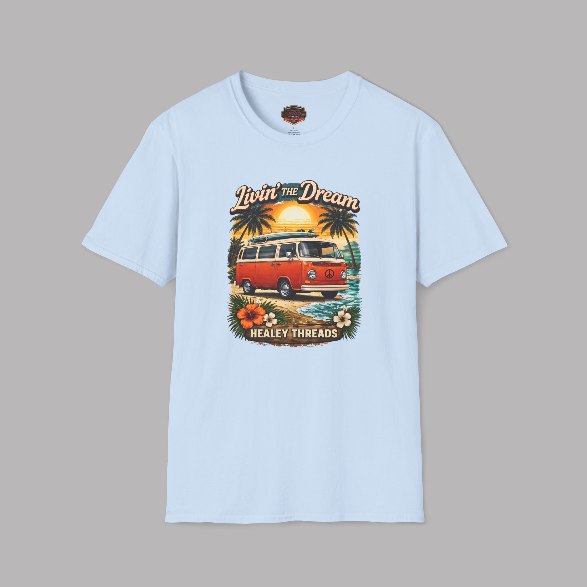 Light blue t-shirt with a graphic of a van and palm trees on a gray background